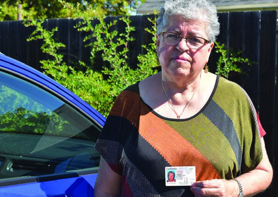 Consuelo beside a car, pictured in her 2023 resident story.
