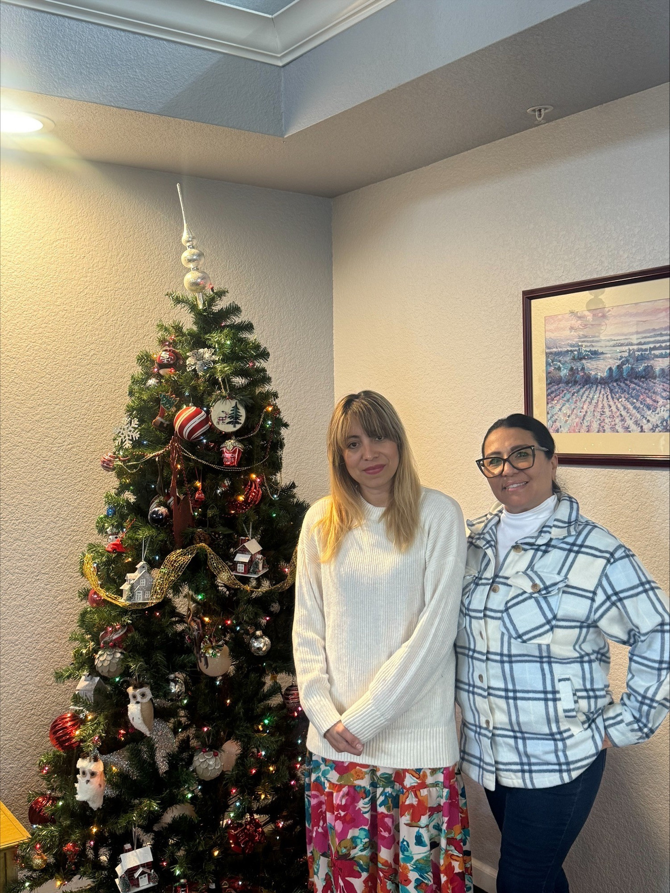 Diana with Resident Services Coordinator Daisy Gomez, pictured in NVCH’s 2025 annual report.