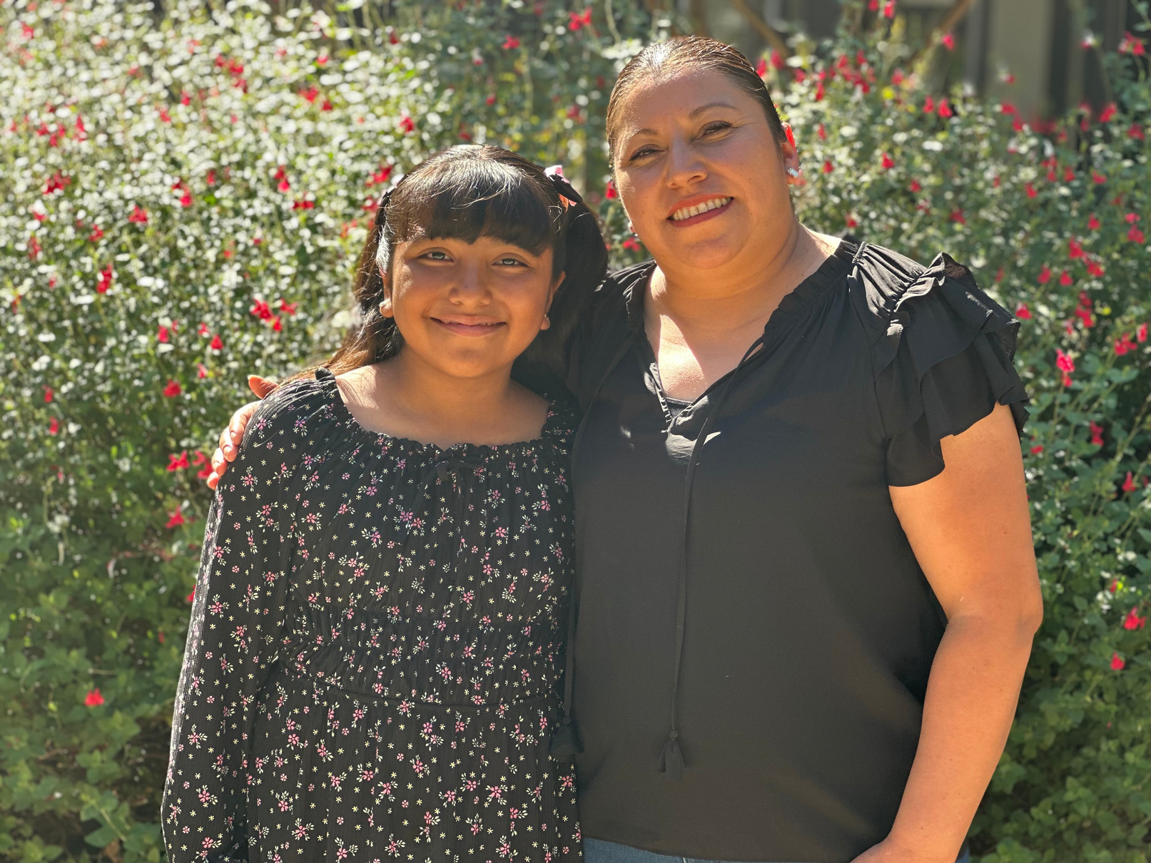 Guadalupe with her mother, pictured in NVCH’s 2024 annual report.